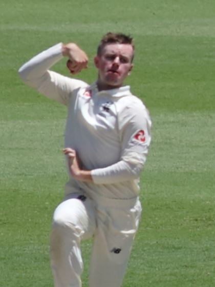 Mason Crane bowling for England